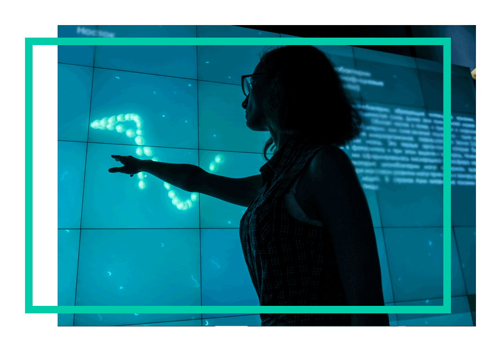 A woman looking at cloud data on a screen