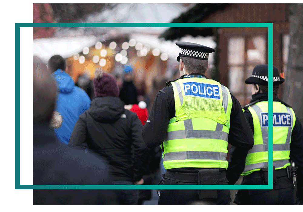 Two police officers patrolling in a crowd